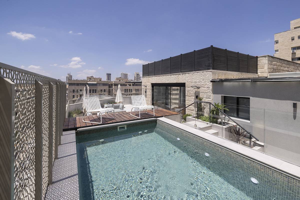 Heated rooftop pool and outdoor dining terrace at Aura Penthouse Jerusalem – photo 10