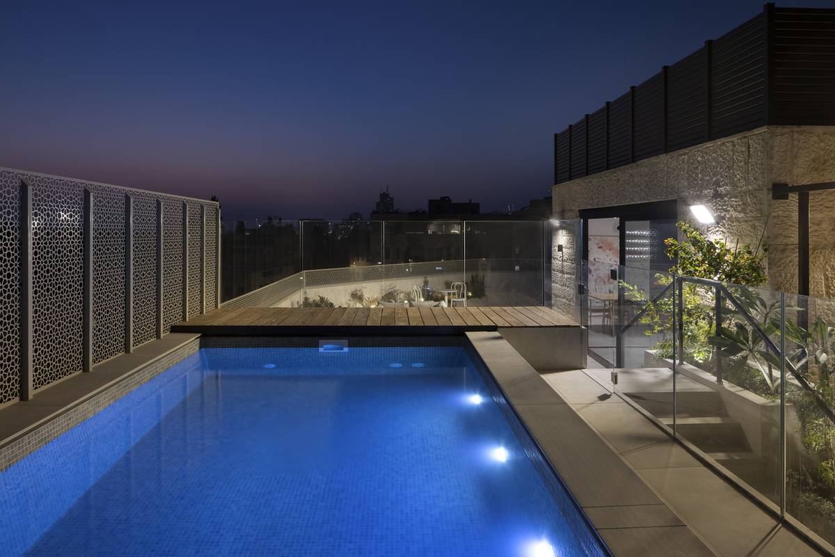Heated rooftop pool and outdoor dining terrace at Aura Penthouse Jerusalem – photo 4