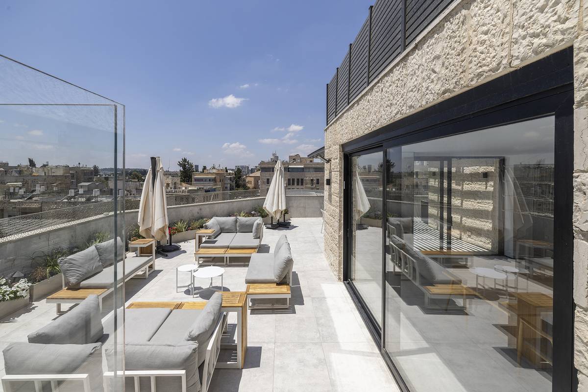 Heated rooftop pool and outdoor dining terrace at Aura Penthouse Jerusalem – photo 9